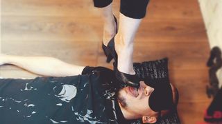 Slave sucks and cleans mistress's shoes while lying at her feet, russian femdom, foot worship