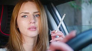 Meet Anastasia In Her Car While She Is Smoking 2 120mm All White Cigarettes