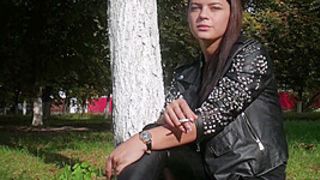 Ravishing Faced Asya Is Smoking A Cigarette Outdoors