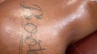 dark Black youngster in oil get large cream-pie