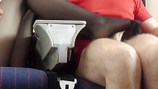 Stewardess gives nylon footjob in plane by Foot Chicks