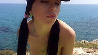 Before taking a tan a sweet whore fingers her pink hole on the beach by Real Agent