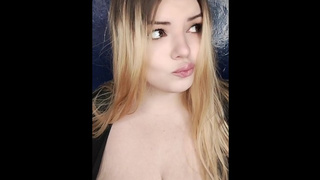 Alluring blonde shows off her giant breasts