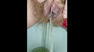 Ravishing fart and big waterfall of piss from a juicy hairy vagina in red panties closeup