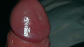 Very close-up of an over-excited rod and streams of pre-spunk!