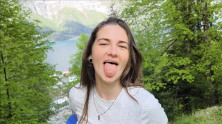 Dirty hiker enjoys a cream pie snack in her mouth when traveling